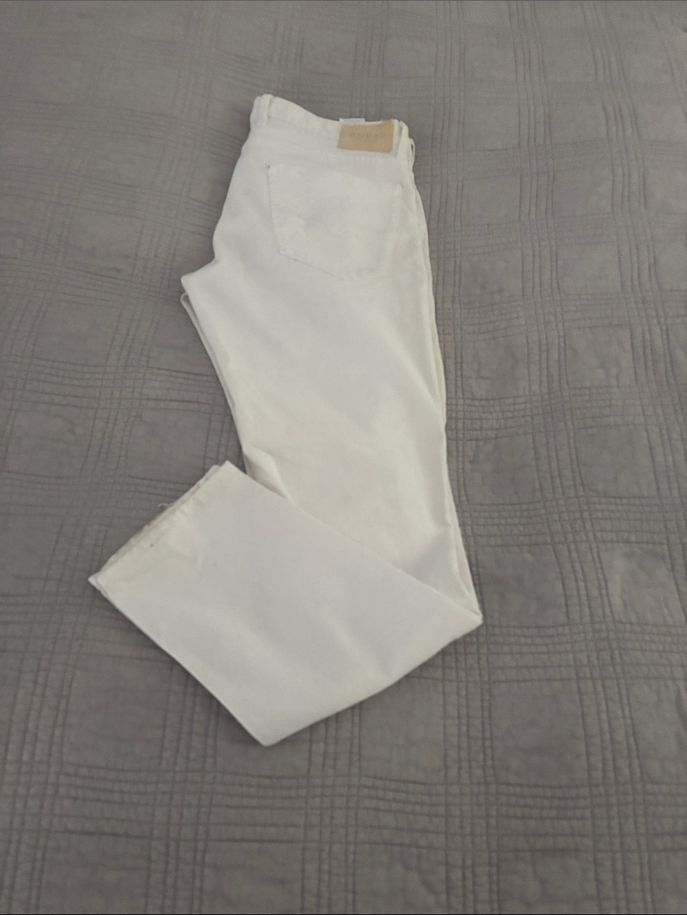 Guess Men’s Slim Jeans White with intentional, distressing, and paint splatter